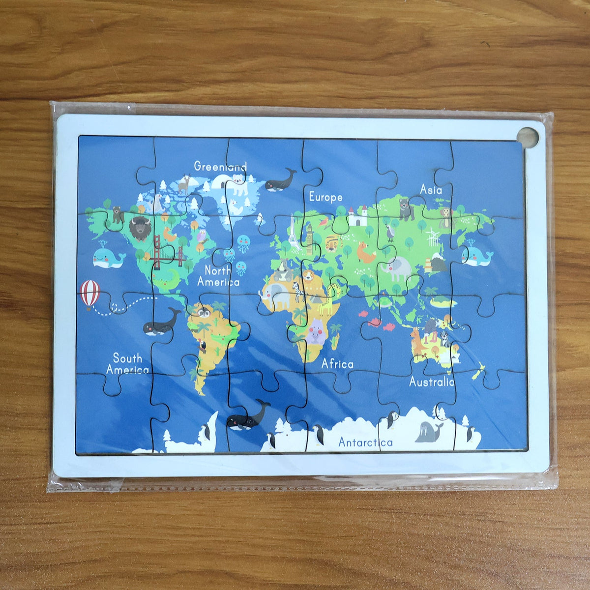 Interactive wooden world map puzzle for kids, promoting hands-on learning.